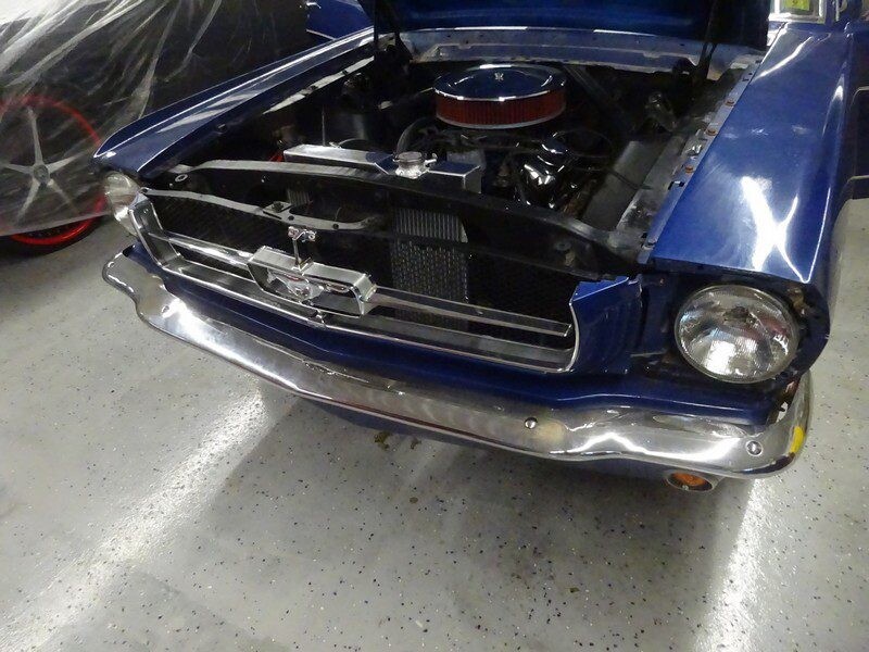 Blue classic Ford Mustang engine bay.