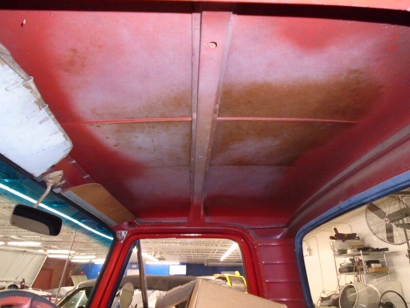 Red truck's stained headliner interior.