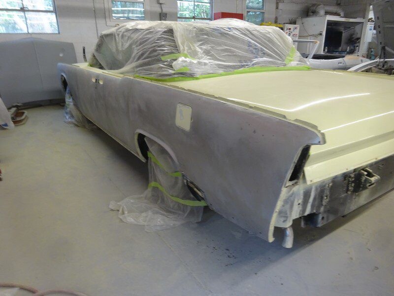 Classic car in auto body shop.