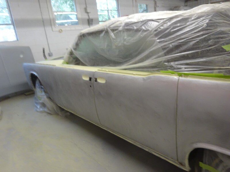 Masked vintage car side prepped for painting