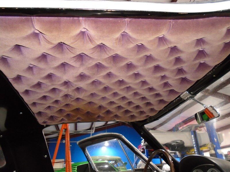 Purple tufted headliner in classic car.
