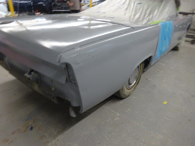 Gray classic car, primered body.