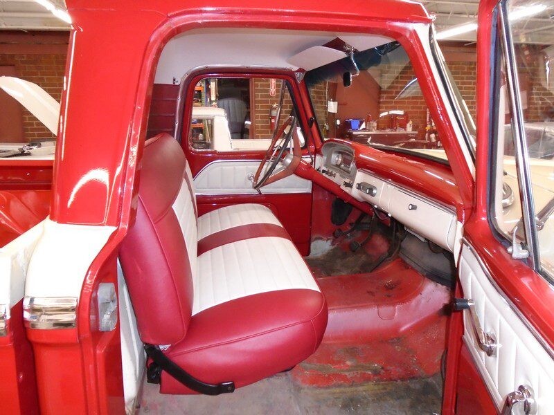 Red and white restored Ford truck interior.