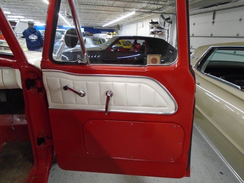Red classic truck door interior detail.