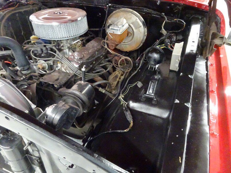 Old engine bay with brake booster and wiring