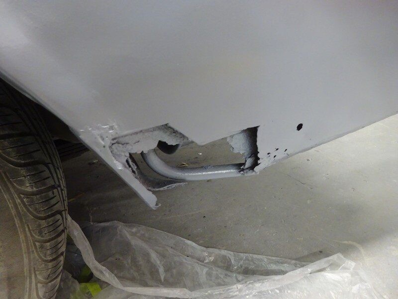 Damaged car body panel needing repair.