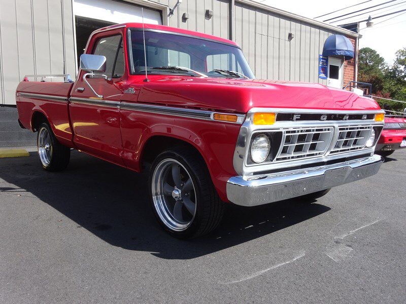 Red Ford F-100 pickup truck.