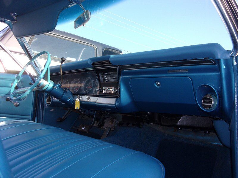 Blue classic car interior dashboard.