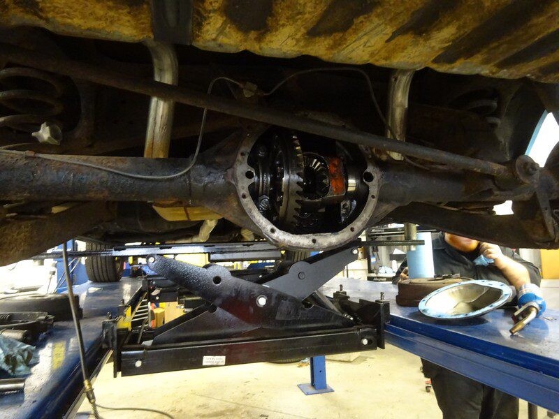 Car's rear differential undergoing repair.