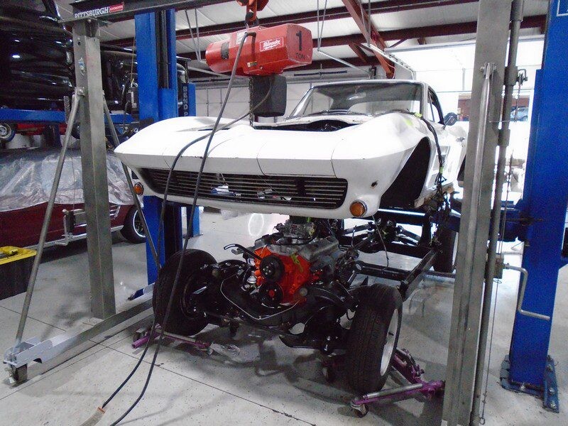 White Corvette engine restoration in progress.