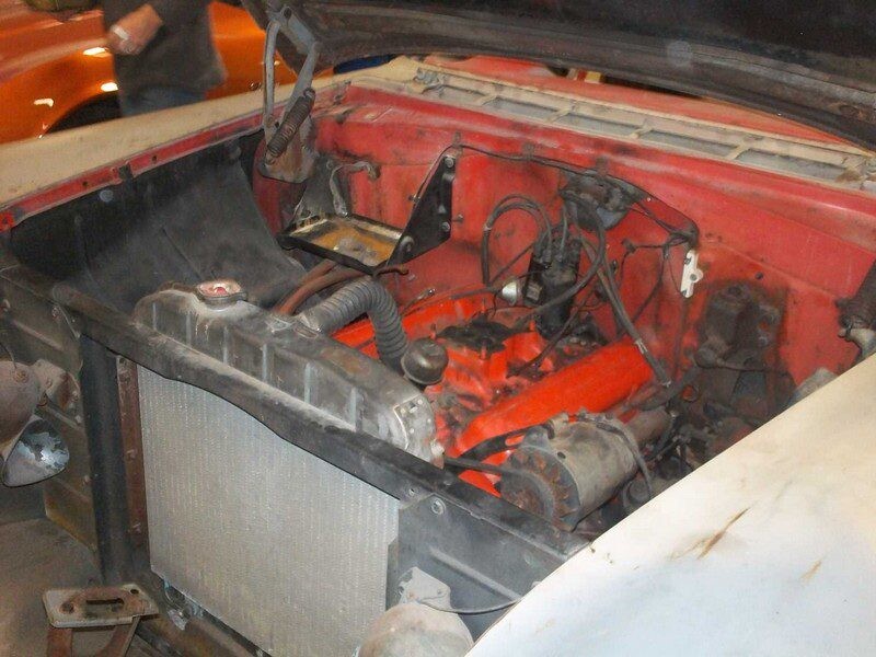 Vintage car with orange engine and radiator