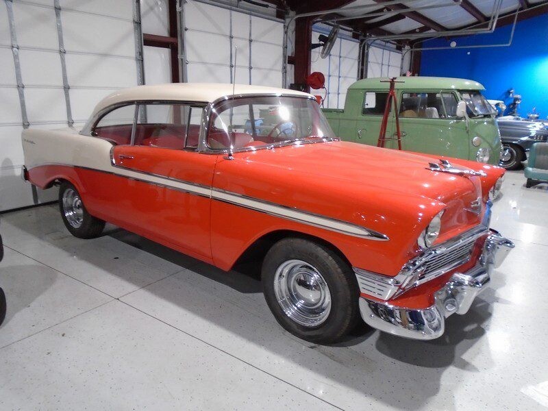 Orange and white color car on the display of the website