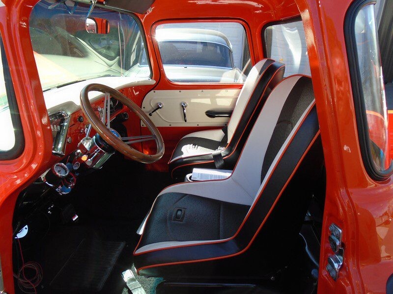 Red classic truck interior, custom seats.