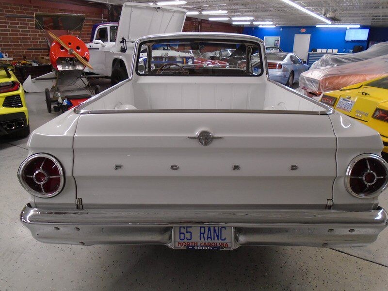 White 1965 Ford Ranchero pickup truck.