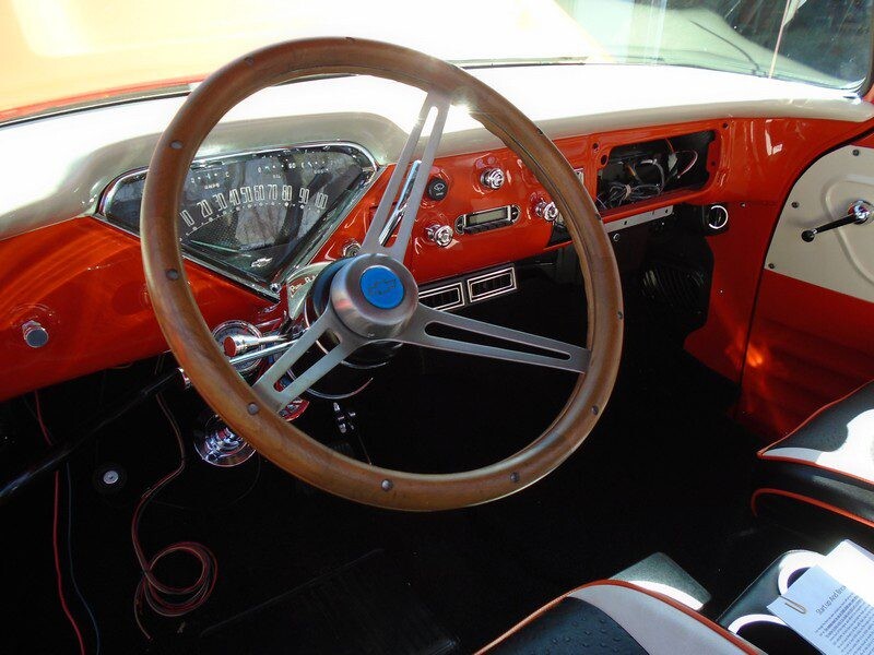 Classic car's interior, wood steering wheel.