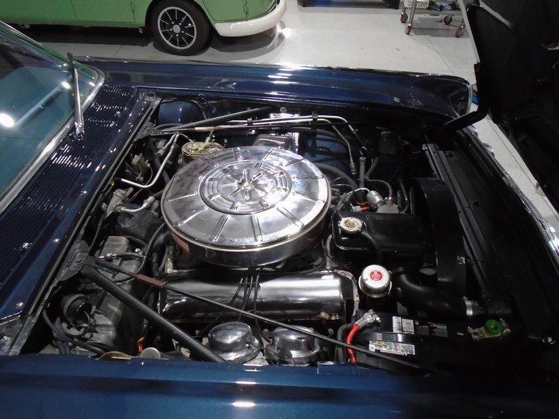 Classic car engine, open hood.