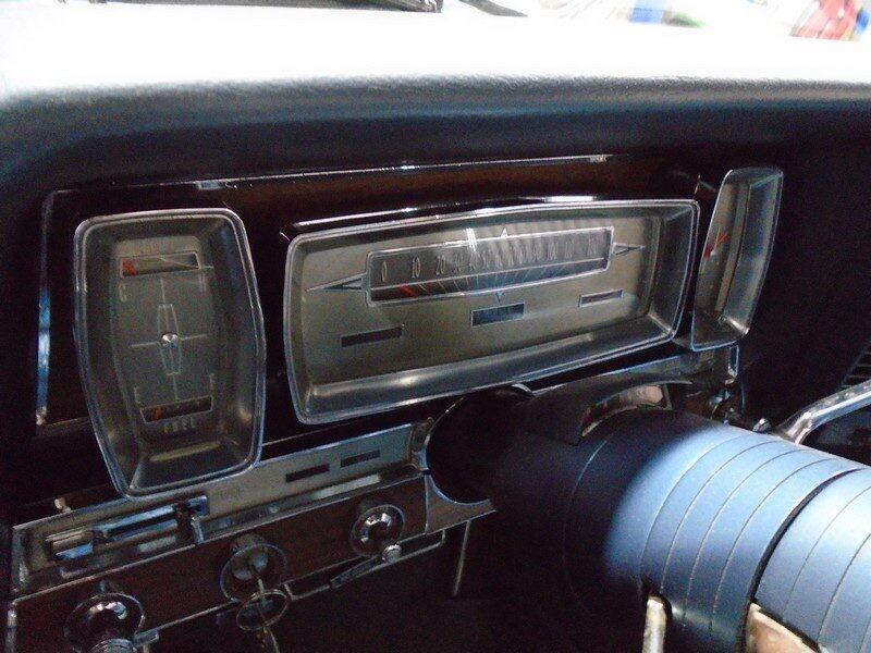 Classic car dashboard with gauges.