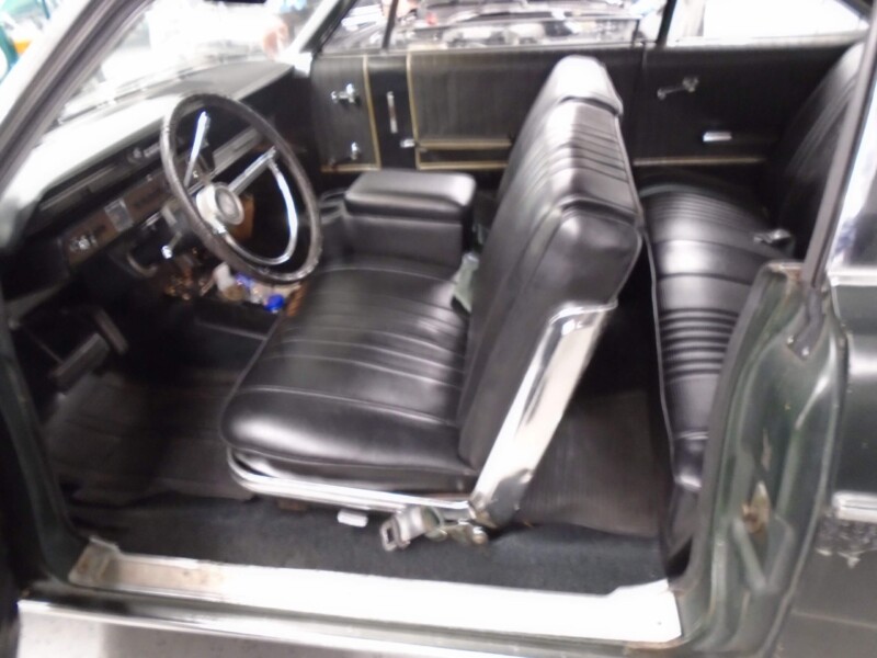Classic car interior, black leather seats.