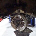 Car drum brake assembly repair.