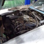 Classic car engine bay, under repair.