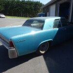 Blue Lincoln Continental classic car.
