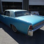 Dusty blue Lincoln Continental classic car.