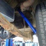 Blue shock absorber and rusty leaf spring.