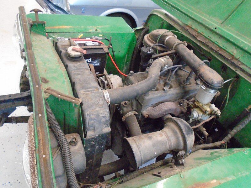 Green vintage jeep engine bay.