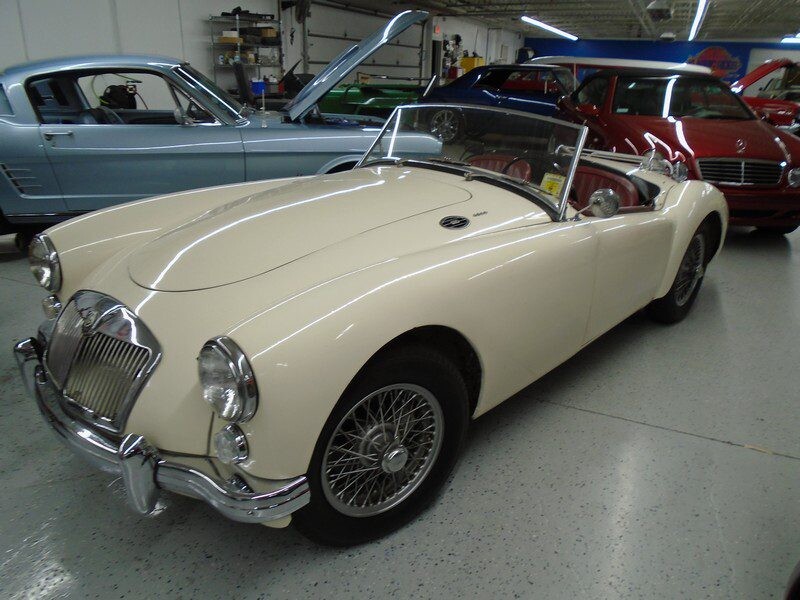 1960 MG parked with other classic cars