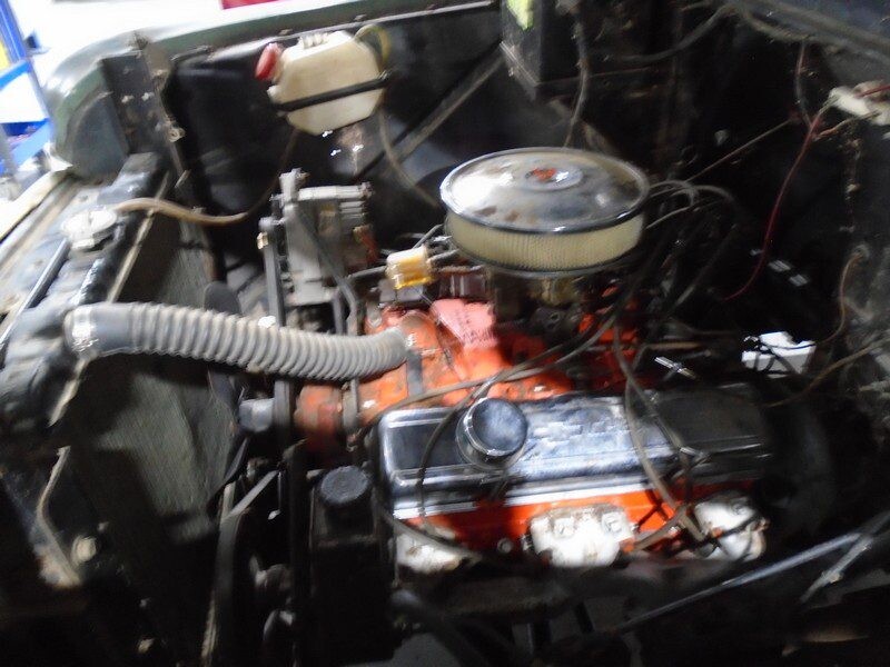 Orange V8 engine with round air filter